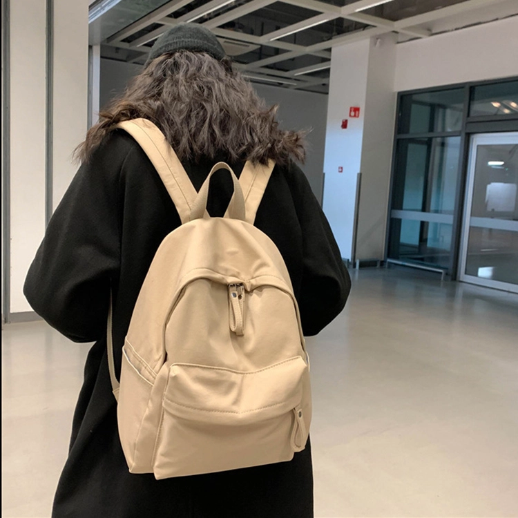 艾妮兔 日系简约百搭初高中大学生休闲通勤 帆布 书包帆布包双肩包 男女同款情侣款 米白色/卡其色/蓝色/黑色
