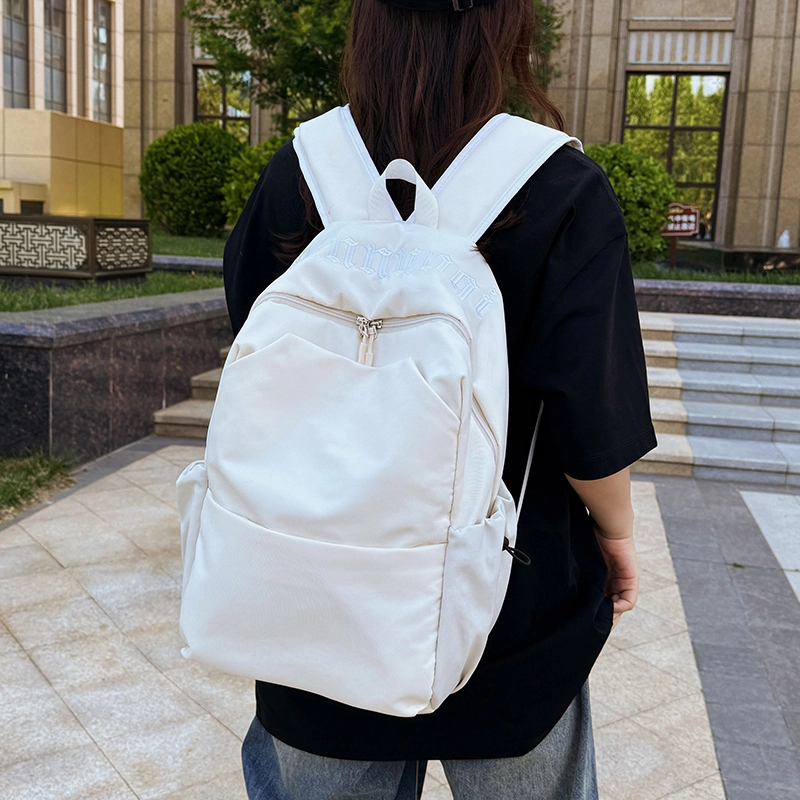 班亚奴 时尚百搭轻便简约 纯色刺绣文艺风背包 初高中大学生上课通勤大容量书包 牛津布 双肩包 男女同款情侣款 黑色/白色/红色/浅蓝色