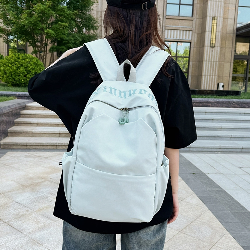 班亚奴 时尚百搭轻便简约 纯色刺绣文艺风背包 初高中大学生上课通勤大容量书包 牛津布 双肩包 男女同款情侣款 黑色/白色/红色/浅蓝色