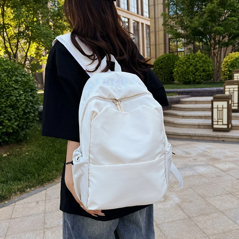 班亚奴 时尚百搭轻便简约 纯色刺绣文艺风背包 初高中大学生上课通勤大容量书包 牛津布 双肩包 男女同款情侣款 黑色/白色/红色/浅蓝色