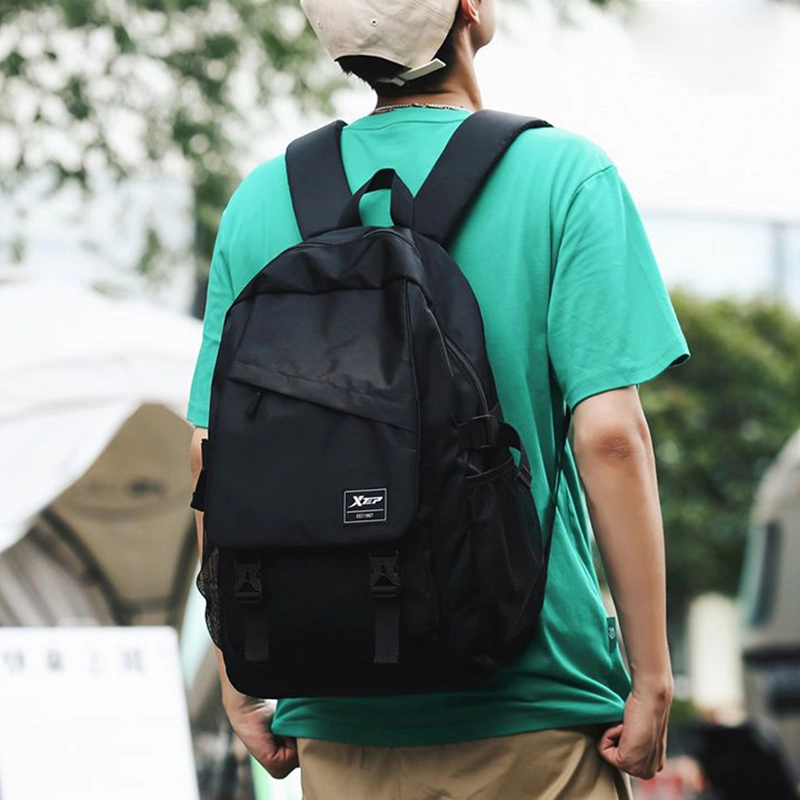 特步 高颜值大容量女初中高中大学上课书包时尚休闲轻便耐用通勤出差背包电脑包 涤纶 双肩包 男女同款情侣款 黑色