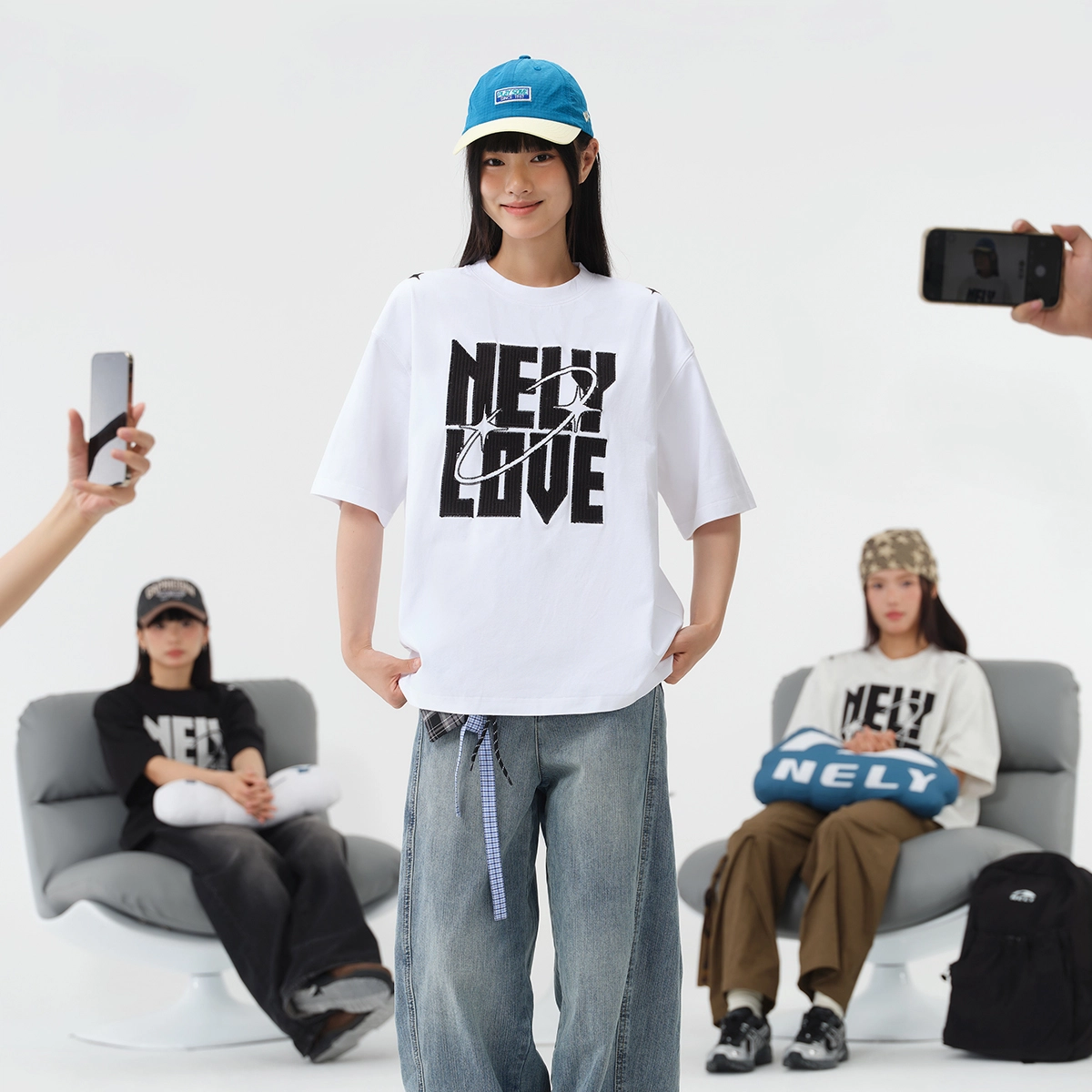 NELY logoT