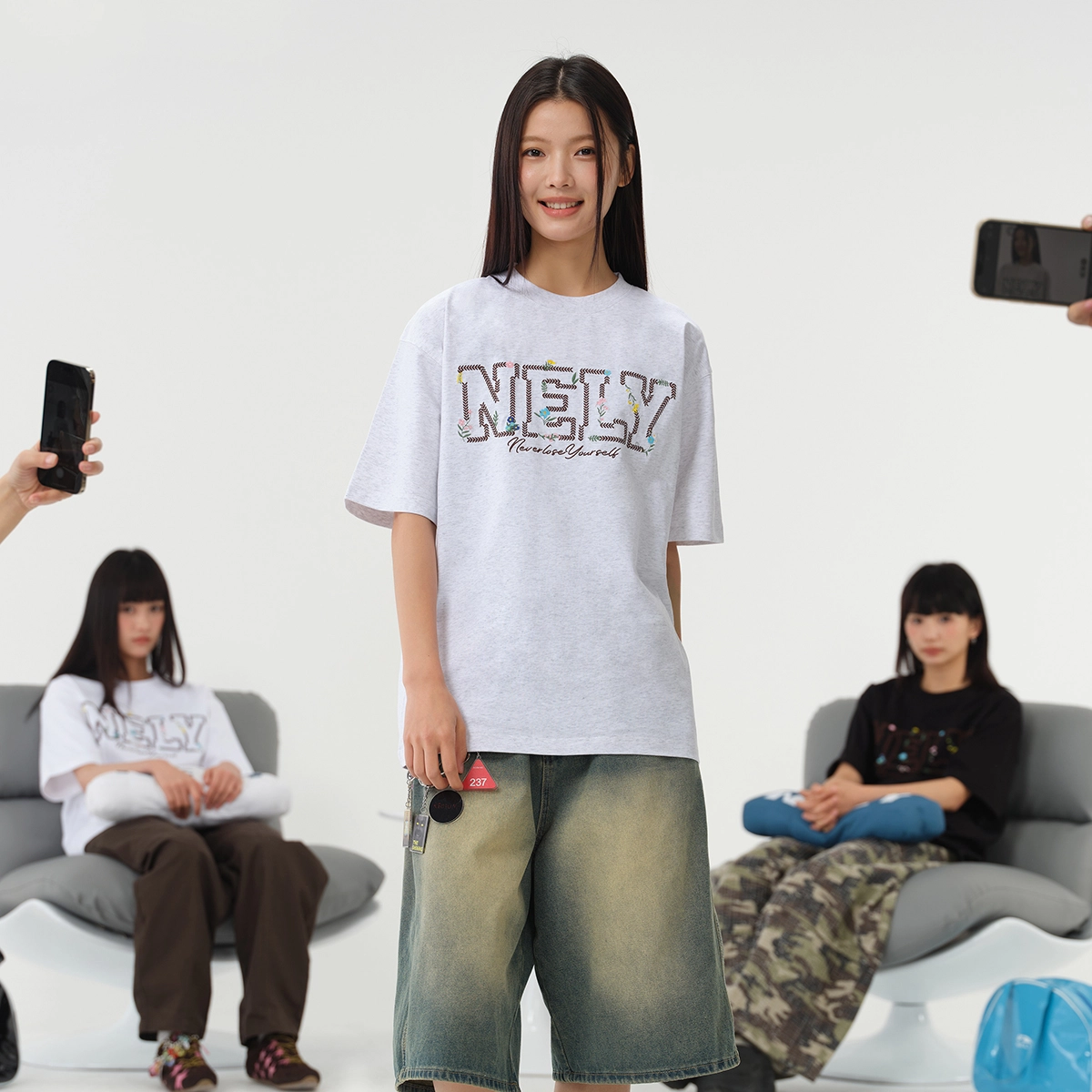 NELY logoT