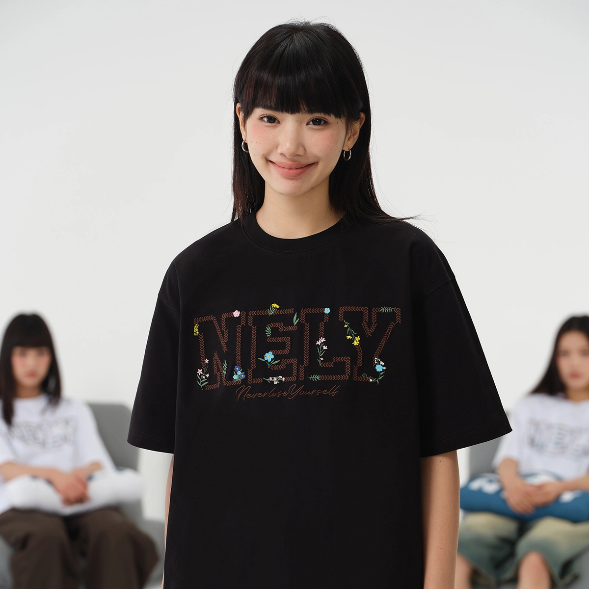 NELY logoT