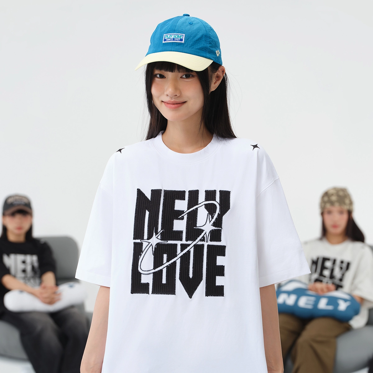 NELY logoT