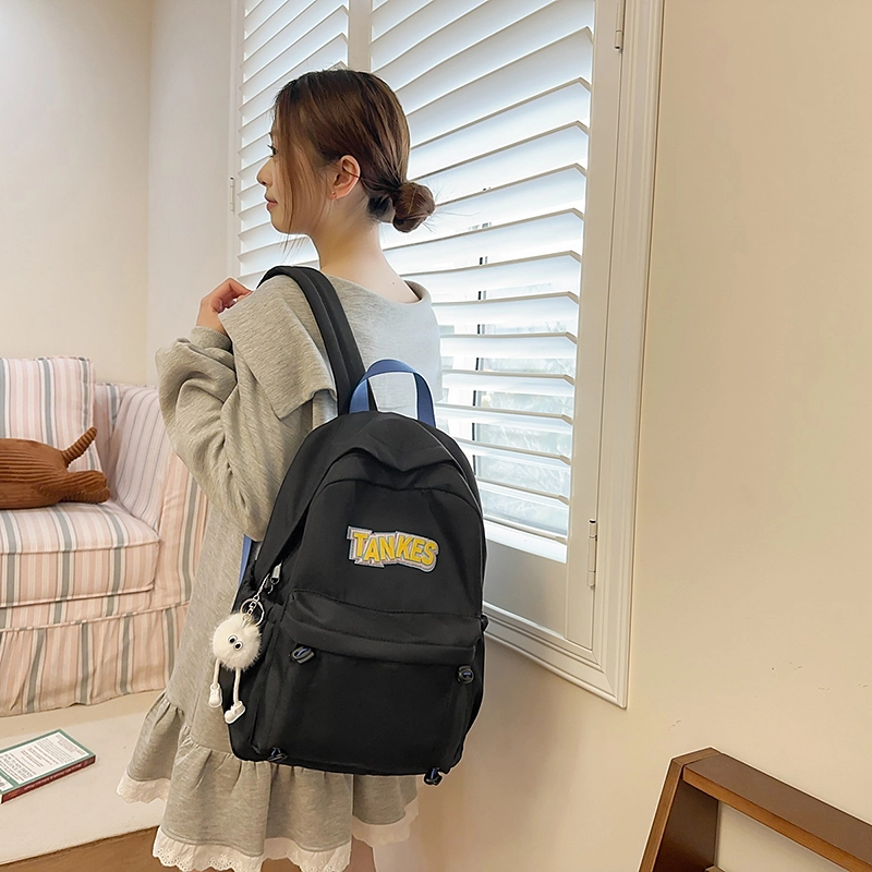 木木兔 轻便减压书包女高中生大容量减负初中小学生  经典时尚小众设计 高级感 休闲拉链开合  牛津纺 双肩包 常规 黑色