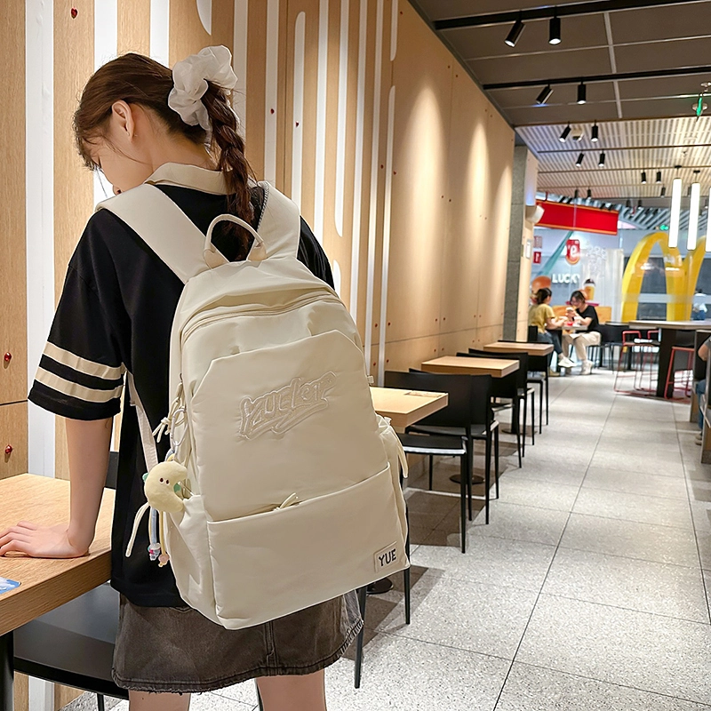 木木兔 超大容量书包女初中生减负高中生 小学生轻便背包 经典时尚小众设计 高级感 休闲拉链开合  尼龙布 双肩包 常规 米白色