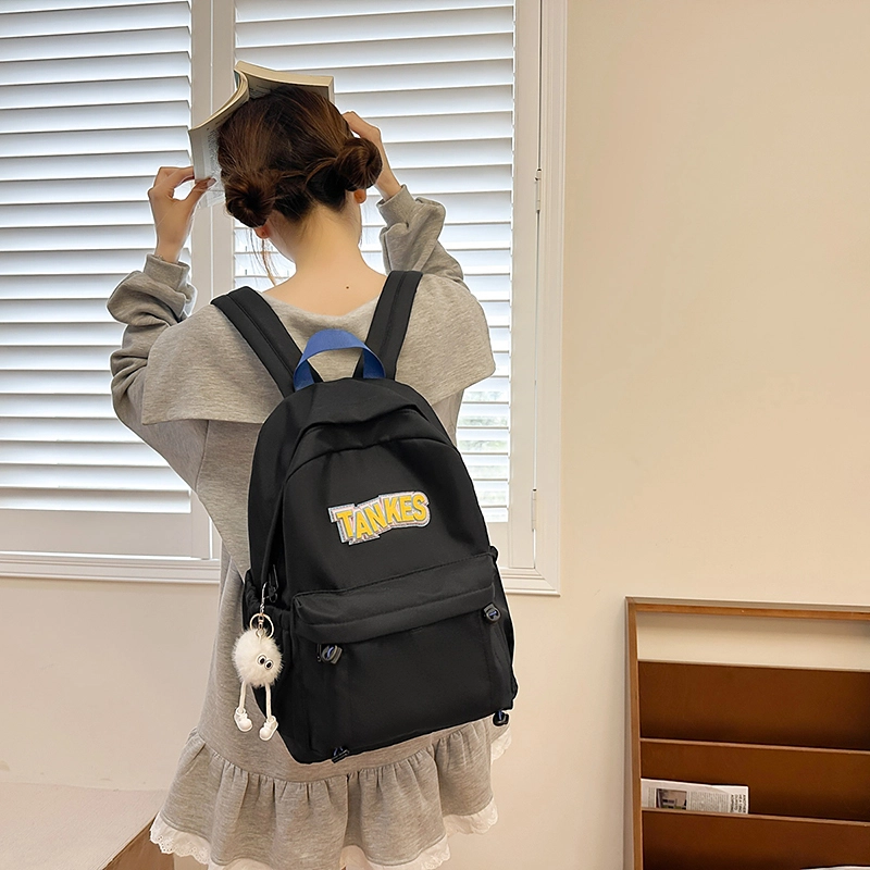 木木兔 轻便减压书包女高中生大容量减负初中小学生  经典时尚小众设计 高级感 休闲拉链开合  牛津纺 双肩包 常规 黑色