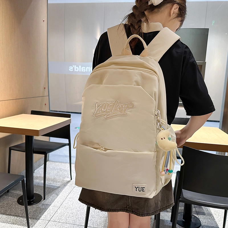 木木兔 超大容量书包女初中生减负高中生 小学生轻便背包 经典时尚小众设计 高级感 休闲拉链开合  尼龙布 双肩包 常规 米白色