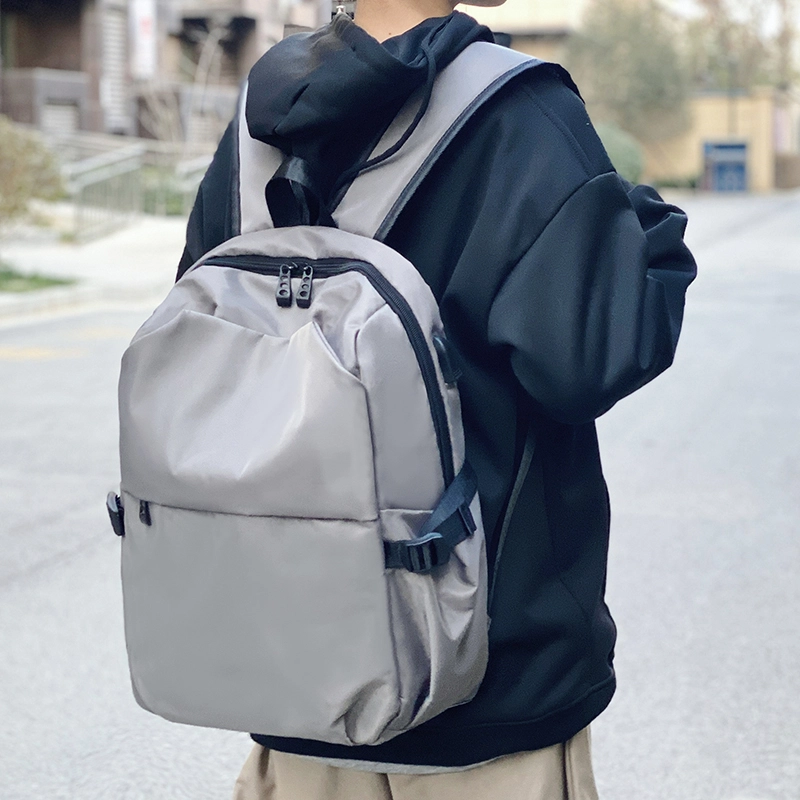普乐威 韩版潮流时尚休闲百搭防水旅行通勤高中初中大学生书包电脑包背包 复合布 双肩包 常规 男女同款情侣款 黑色/灰色