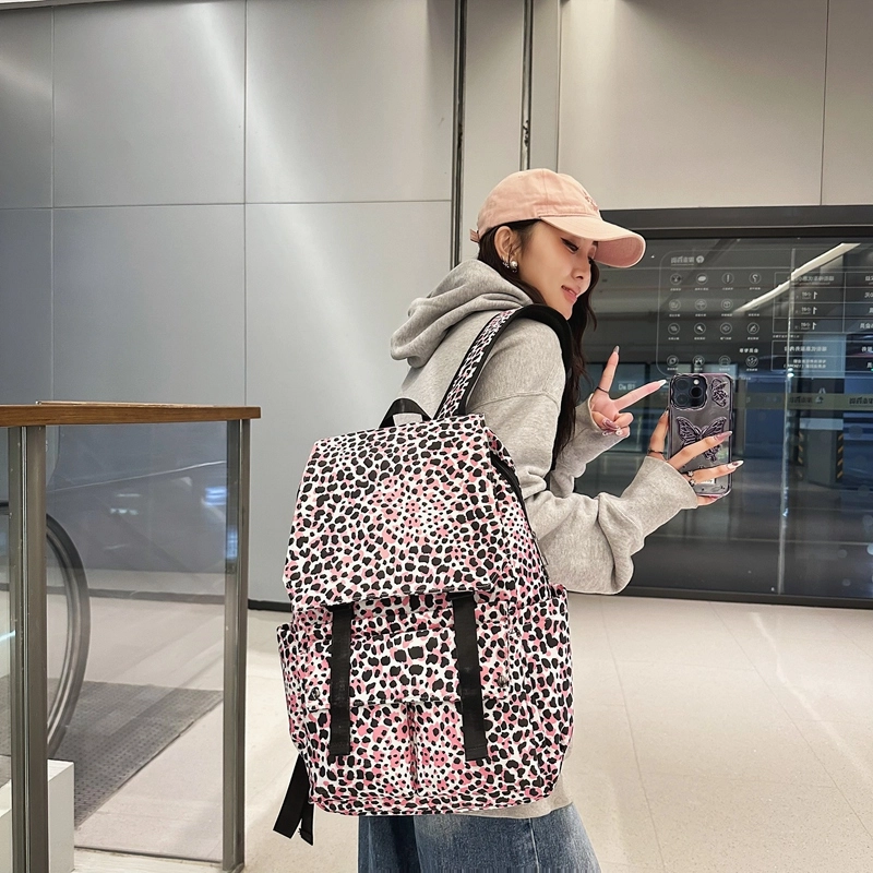 行途 韩版时尚休闲大容量校园日系翻盖豹纹 尼龙 双肩包 常规 男女同款情侣款 白色/蓝色/粉色