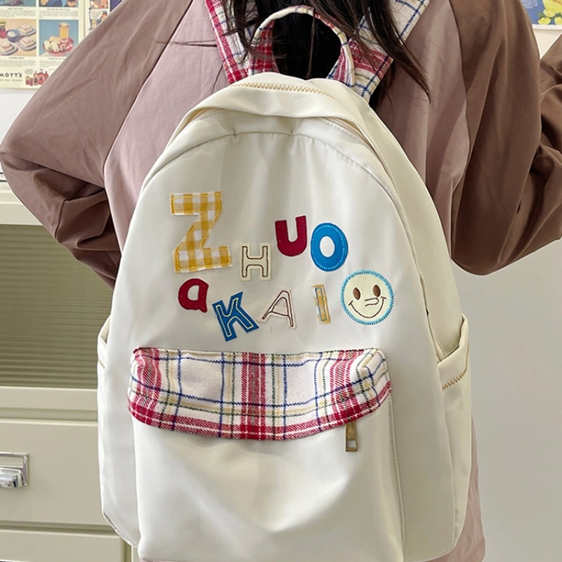 泰格奴 字母印花轻便简约国风大容量运动耐磨背包初中生高中生大学生上课百搭书包 尼龙 双肩包 女款 白色绿色黄色蓝色
