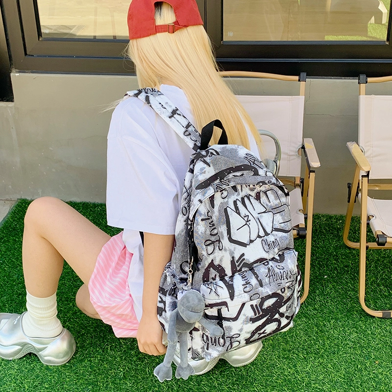 泰格奴 涂鸦精美机能通勤旅行小清新轻便高颜值大容量背包初中高中大学生上课百搭书包 尼龙布 双肩包 男女同款情侣款 灰白色/黑白色