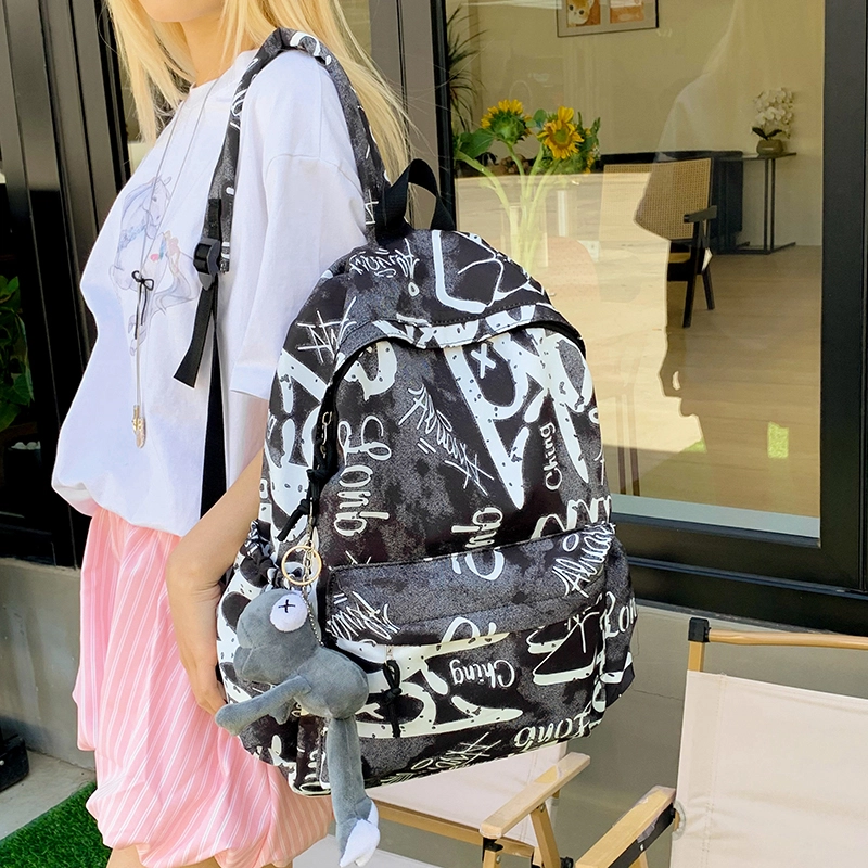 泰格奴 涂鸦精美机能通勤旅行小清新轻便高颜值大容量背包初中高中大学生上课百搭书包 尼龙布 双肩包 男女同款情侣款 灰白色/黑白色