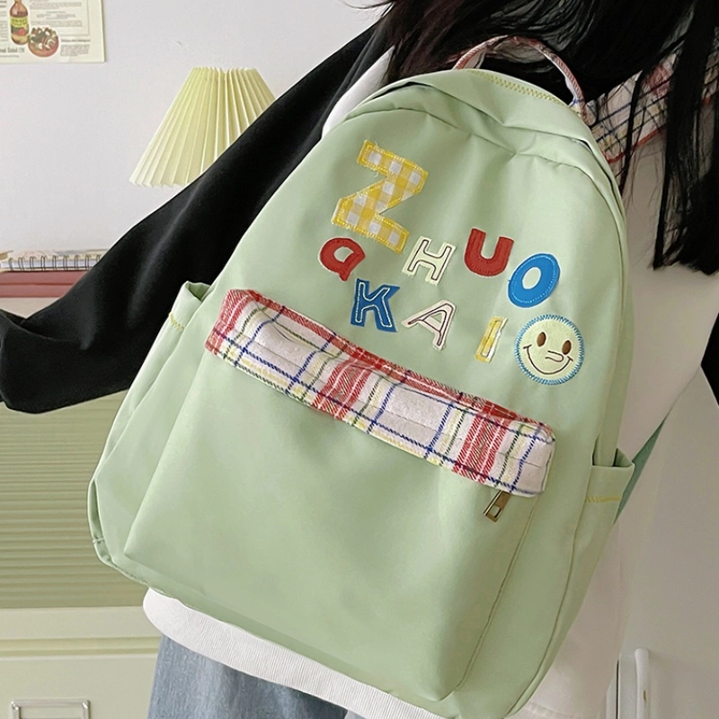 泰格奴 字母印花轻便简约国风大容量运动耐磨背包初中生高中生大学生上课百搭书包 尼龙 双肩包 女款 白色绿色黄色蓝色