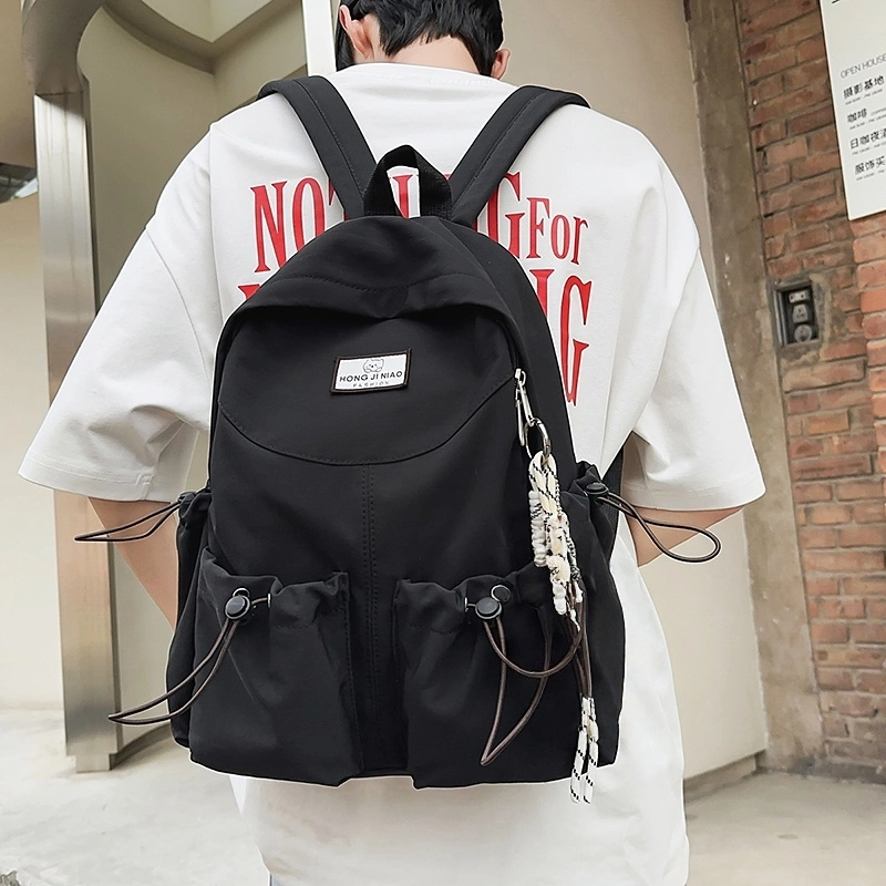 泰格奴 美式报纸涂鸦高级感潮流高街大容量背包初高中大学生上课书包 尼龙 双肩包 男女同款情侣款 黑色/粉红色/卡其色/绿色