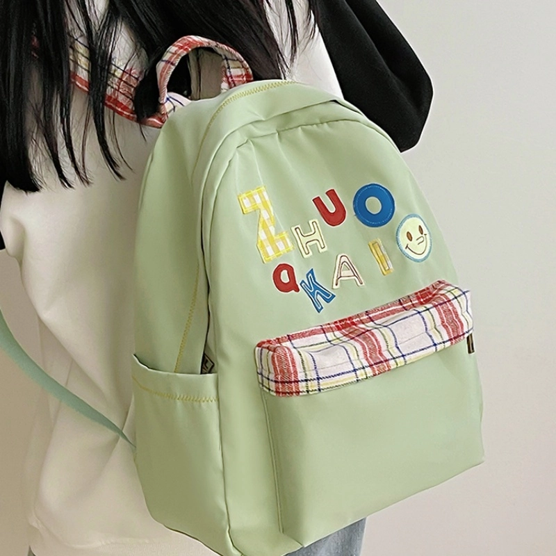 泰格奴 字母印花轻便简约国风大容量运动耐磨背包初中生高中生大学生上课百搭书包 尼龙 双肩包 女款 白色绿色黄色蓝色