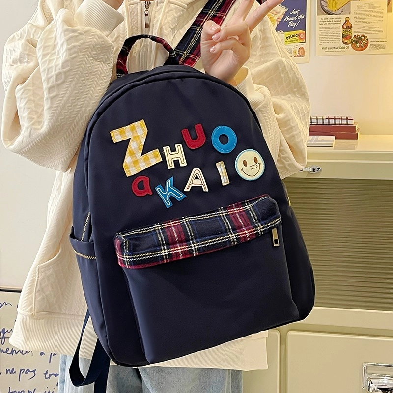 泰格奴 字母印花轻便简约国风大容量运动耐磨背包初中生高中生大学生上课百搭书包 尼龙 双肩包 女款 白色绿色黄色蓝色