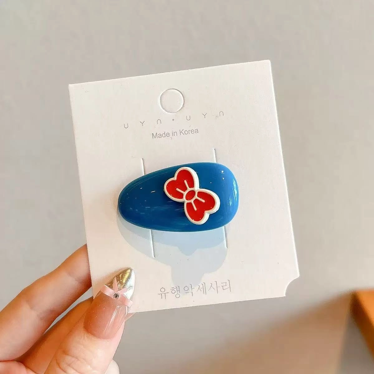 希铃 红蓝蝴蝶结椭圆前额碎发#好运 亚克力 发夹 女款