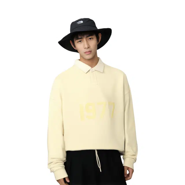 Fear of God Essentials FW22 Henley Rugby Canary Polo