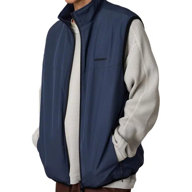 Gramicci NEUTRAL KNITTED VEST Logo