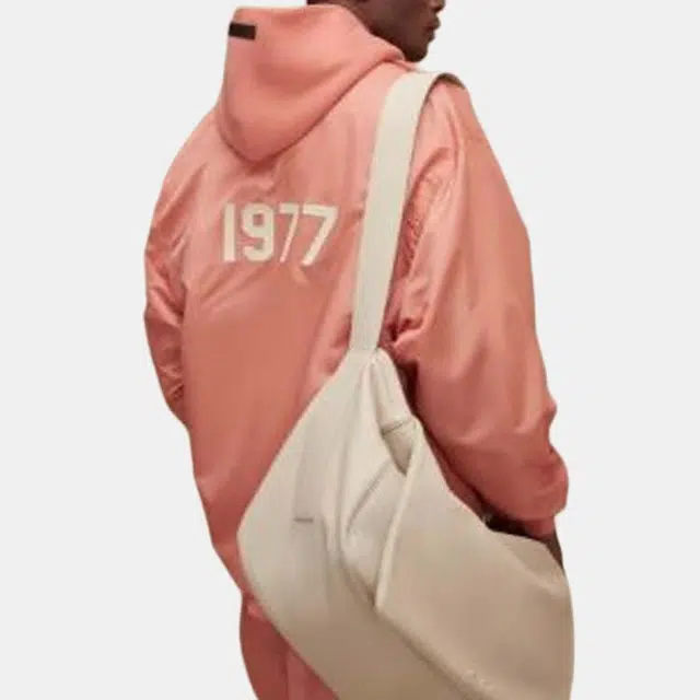 Fear of God Essentials FW22 1977 Nylon Coaches Jacket Coral Logo