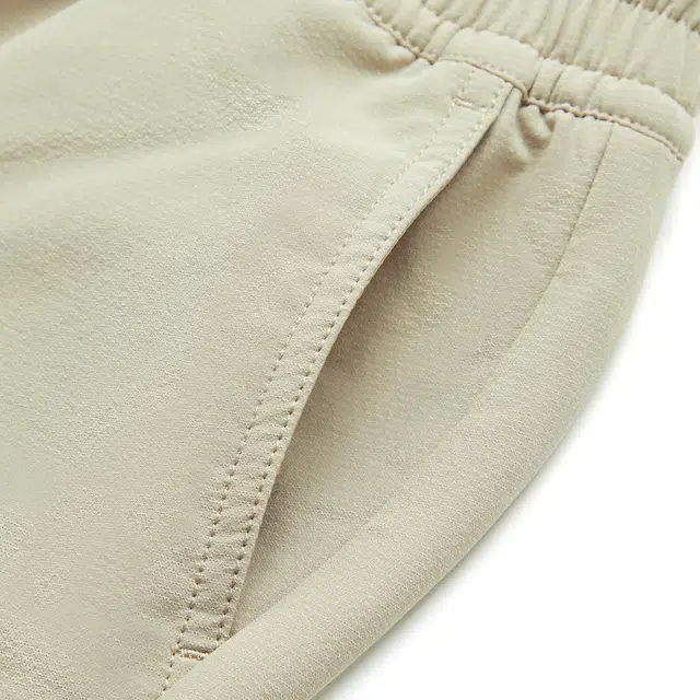 李宁儿童 运动生活系列 童装系列 保暖宽松舒适长裤 中卡其 青少年