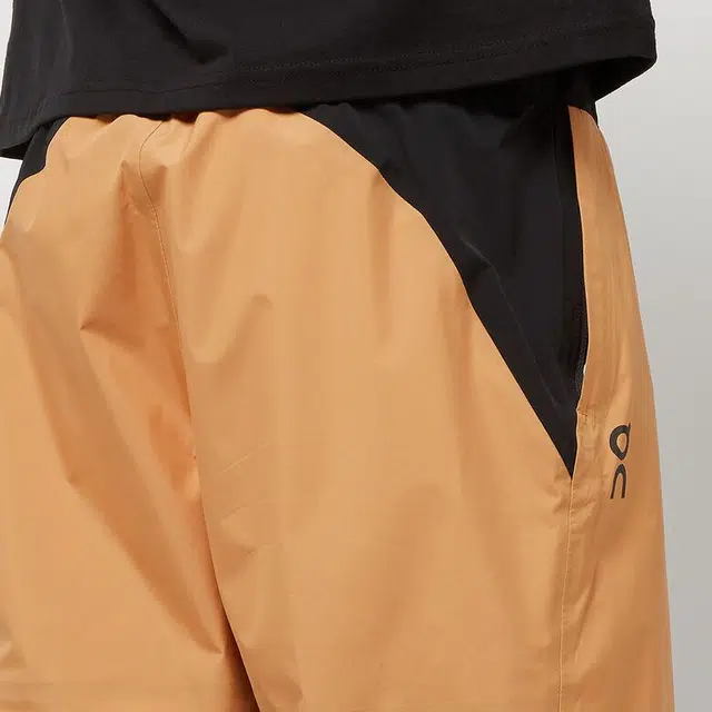On Storm Pants logo