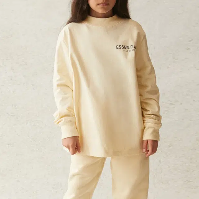 Fear of God Essentials SS21 Kids Long Sleeve Tee ButtercreamCream LogoT
