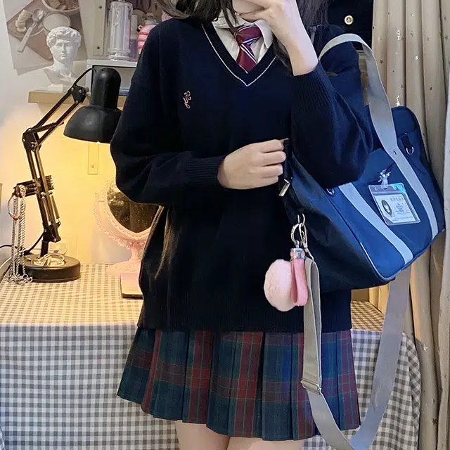 东鲸岁时记 经典学院风格纹百褶短款半身裙 圣诞红格