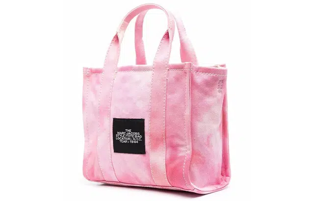 MARC JACOBS MJ The Traveler logo