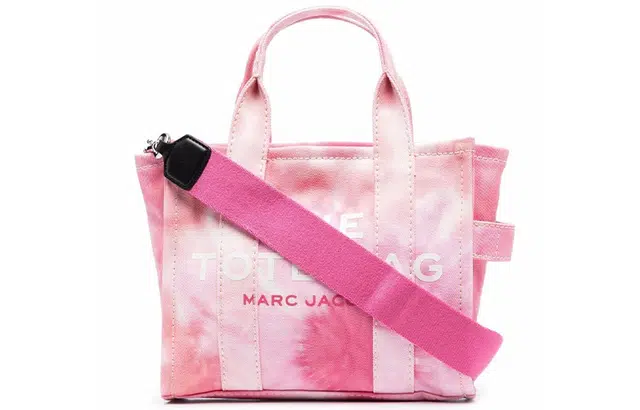 MARC JACOBS MJ The Traveler logo
