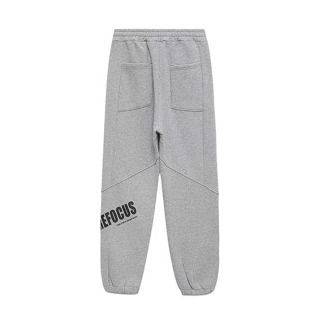 美特斯邦威 宽松直筒字母印花束脚针织运动裤 女款