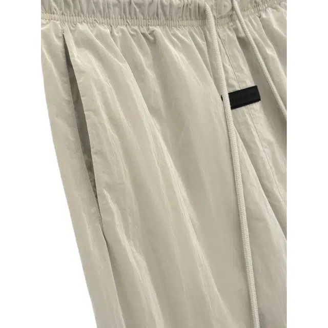 Fear of God Essentials SS24 drop2 Crinkle Nylon Trackpants GARDEN YELLOW