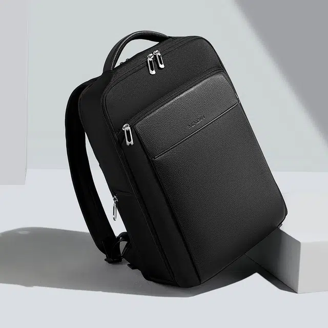 稻草人 轻便出行大容量商务多口袋电脑背包 牛皮 双肩包 常规 男款 黑色