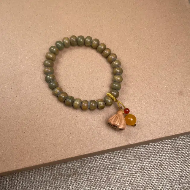 中藏  绿檀算盘珠 莲蓬转运珠 新中式国风古韵 好运莲蓬 盘玩精致百搭手链 木质  木作手串 女款 绿檀