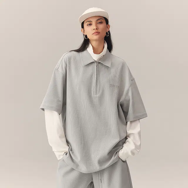 CHINISM Logo Embroidered Half-Zip Polo Shirt