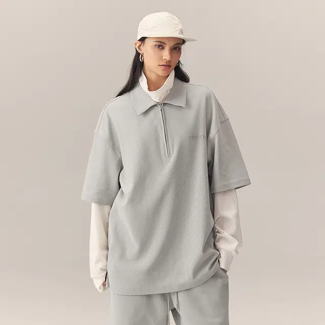 CHINISM Logo Embroidered Half-Zip Polo Shirt