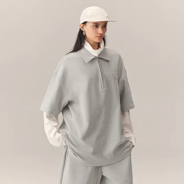 CHINISM Logo Embroidered Half-Zip Polo Shirt