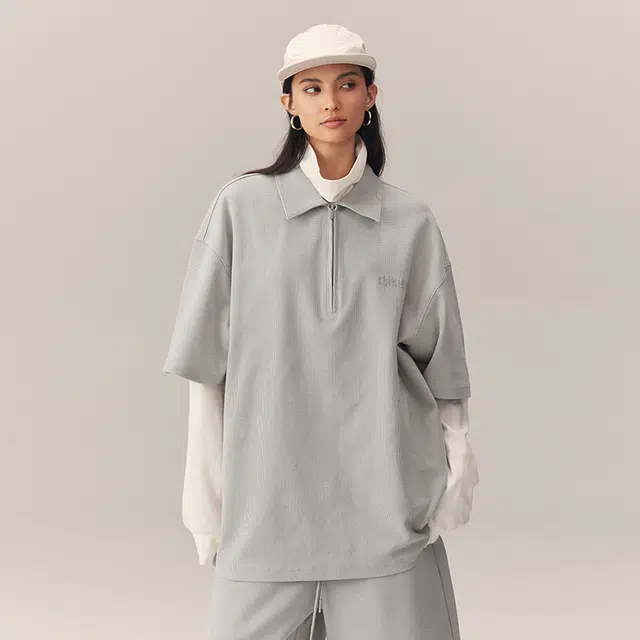 CHINISM Logo Embroidered Half-Zip Polo Shirt