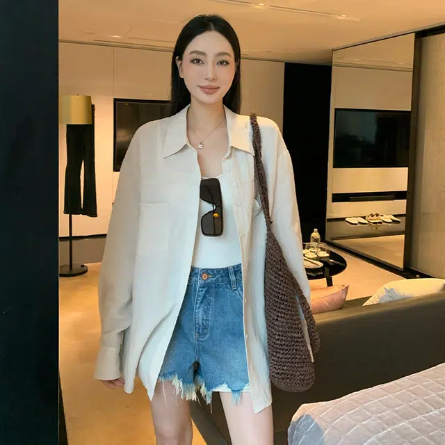 周淼 纯色纽扣长袖衬衫 女款