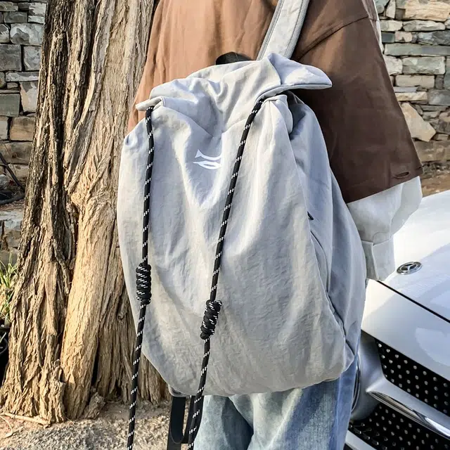 笛贝嘉 韩版简约大容量旅游背包抽绳纯色休闲运动学生书包 复合布 双肩包 男女同款情侣款 多色