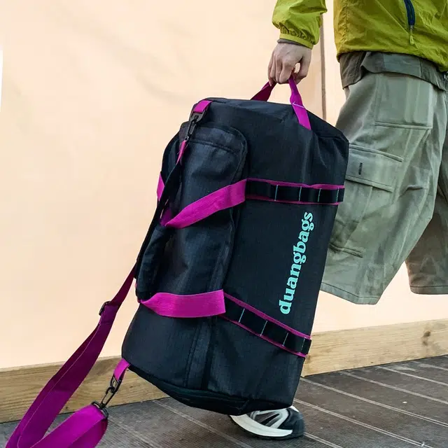 笛贝嘉 出游大容量多功能背包小众字母防水轻体耐磨 复合布 旅行包 男女同款情侣款 多色