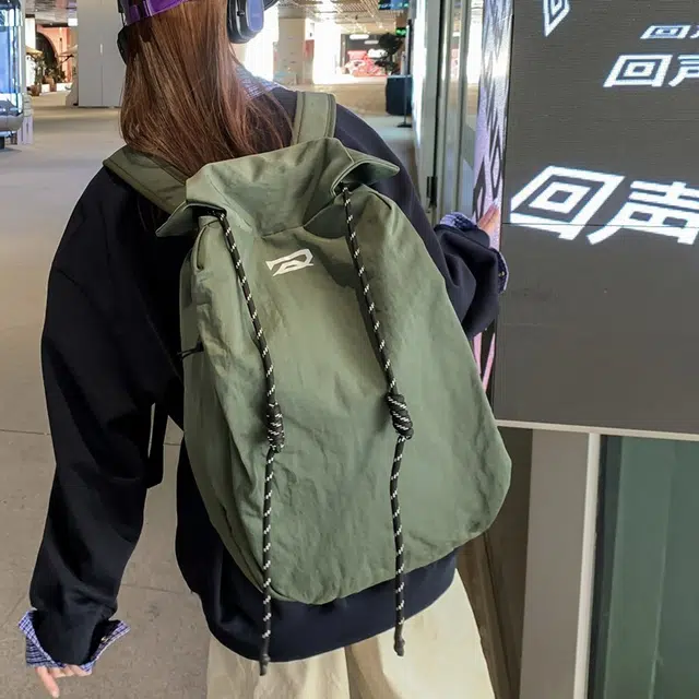 笛贝嘉 韩版简约大容量旅游背包抽绳纯色休闲运动学生书包 复合布 双肩包 男女同款情侣款 多色