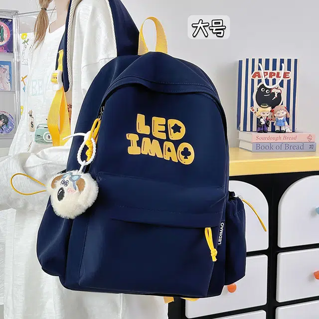 笛贝嘉 韩版初中生大容量字母背包高中生大学生休闲轻便时尚书包 涤纶 双肩包 男女同款情侣款 多色