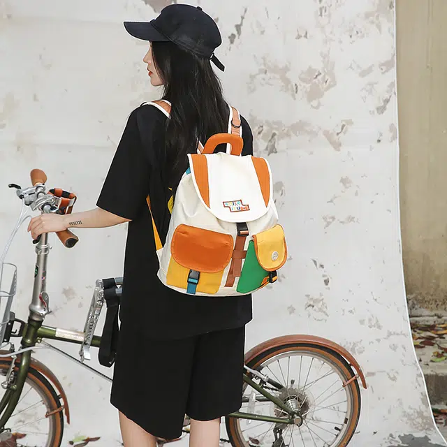 笛贝嘉 小众拼色抽绳学生上课复古百搭 尼龙 双肩包 男女同款情侣款 橘色/黄色