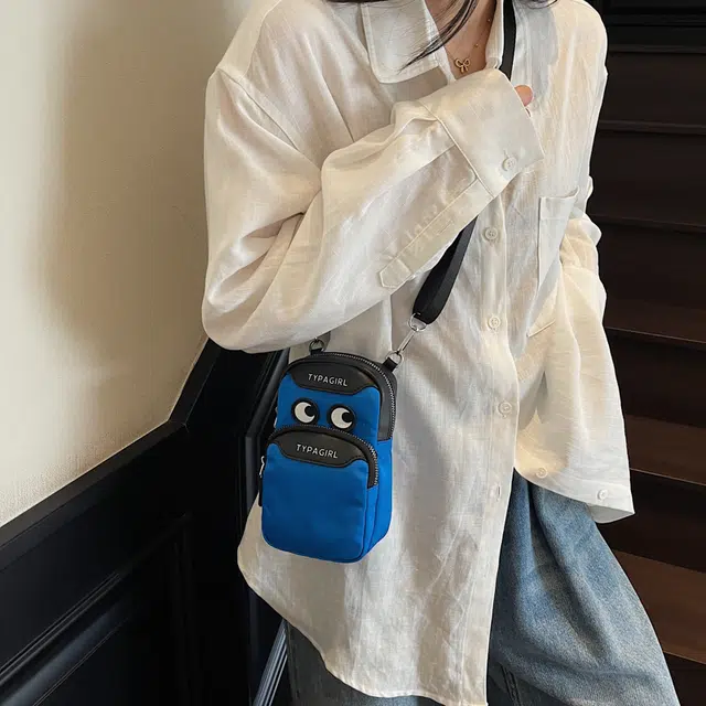 笛贝嘉 可爱大眼睛防泼水小挎包潮流个性 布 单肩包 常规 男女同款情侣款 多色