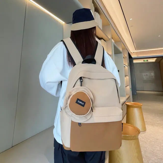 笛贝嘉 日系休闲小众拼色大容量背包简约通勤轻便 帆布 双肩包 男女同款情侣款 黄色/卡其色/紫色/绿色