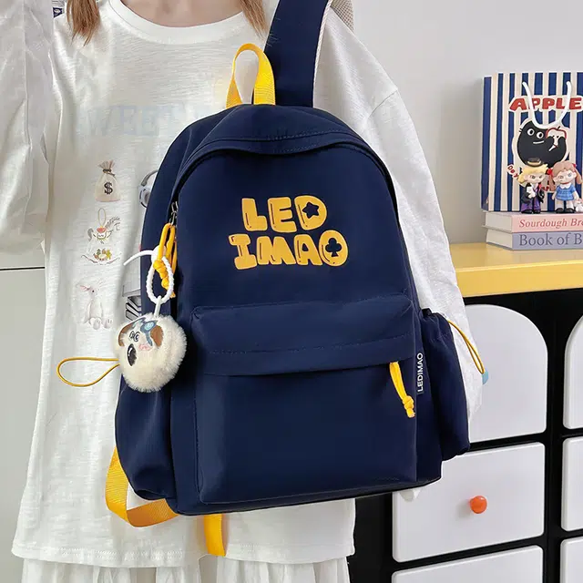 笛贝嘉 韩版初中生大容量字母背包高中生大学生休闲轻便时尚书包 涤纶 双肩包 男女同款情侣款 多色