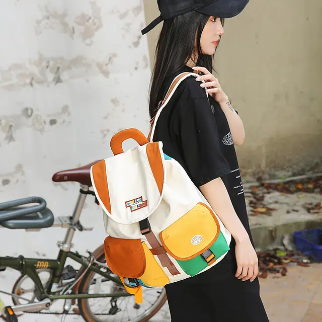 笛贝嘉 小众拼色抽绳学生上课复古百搭 尼龙 双肩包 男女同款情侣款 橘色/黄色